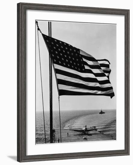 Airplane on Battleship Deck with American Flag in Foreground, World War II--Framed Photo