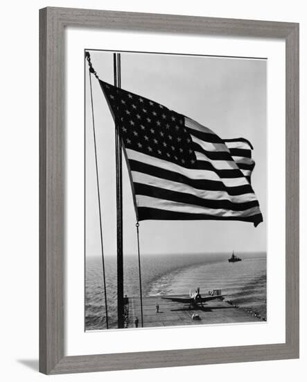 Airplane on Battleship Deck with American Flag in Foreground, World War II-null-Framed Photo