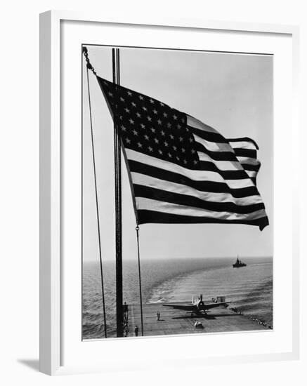 Airplane on Battleship Deck with American Flag in Foreground, World War II--Framed Photo