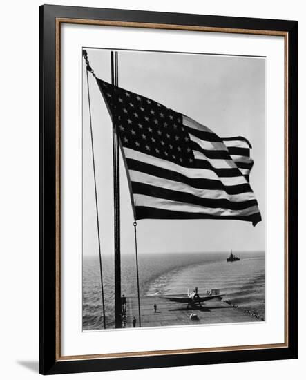 Airplane on Battleship Deck with American Flag in Foreground, World War II-null-Framed Photo