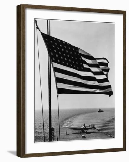 Airplane on Battleship Deck with American Flag in Foreground, World War II--Framed Photo