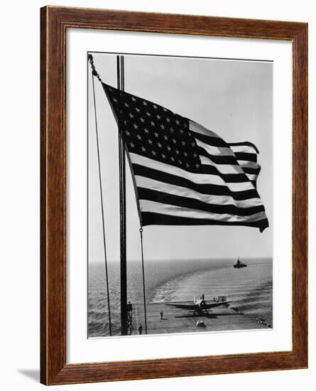 Airplane on Battleship Deck with American Flag in Foreground, World War II--Framed Photo