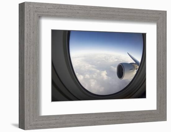 Airplane Window Looking Out on Cloudy Sky-Paul Souders-Framed Photographic Print