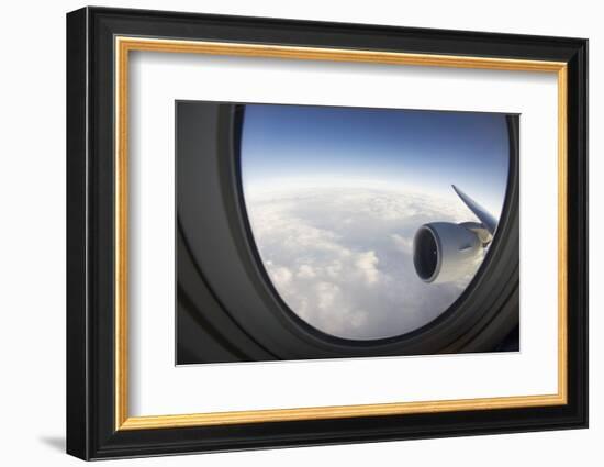 Airplane Window Looking Out on Cloudy Sky-Paul Souders-Framed Photographic Print