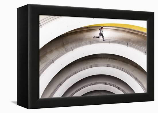 Airport Car Park, Stuttgart, Baden-Württemberg, Germany: A Male Runner Running Through A Car Park-Axel Brunst-Framed Premier Image Canvas