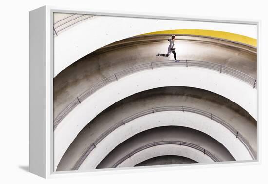 Airport Car Park, Stuttgart, Baden-Württemberg, Germany: A Male Runner Running Through A Car Park-Axel Brunst-Framed Premier Image Canvas