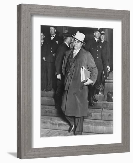 Al Capone, Winks at Photographers as He Leaves Chicago's Federal Courthouse-null-Framed Photo