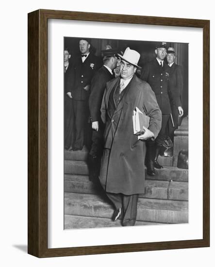 Al Capone, Winks at Photographers as He Leaves Chicago's Federal Courthouse-null-Framed Photo