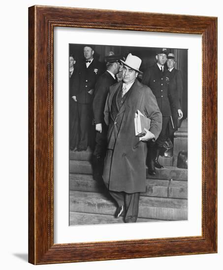 Al Capone, Winks at Photographers as He Leaves Chicago's Federal Courthouse-null-Framed Photo