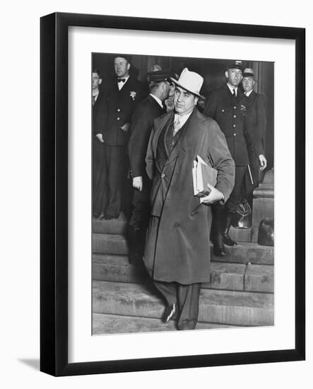 Al Capone, Winks at Photographers as He Leaves Chicago's Federal Courthouse-null-Framed Photo