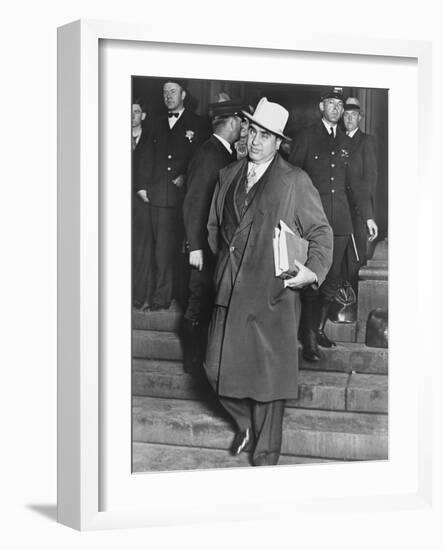 Al Capone, Winks at Photographers as He Leaves Chicago's Federal Courthouse-null-Framed Photo