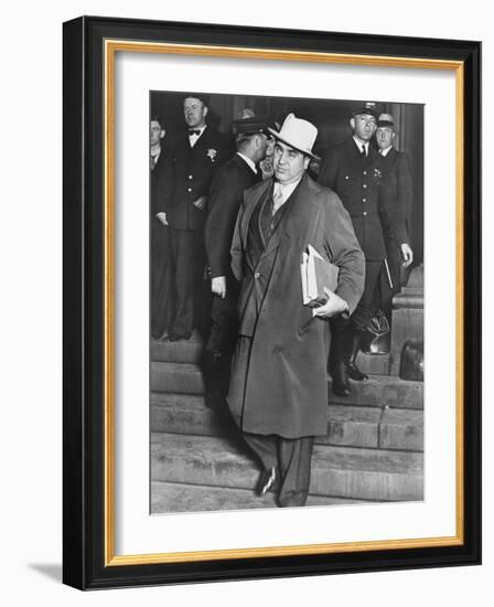 Al Capone, Winks at Photographers as He Leaves Chicago's Federal Courthouse-null-Framed Photo