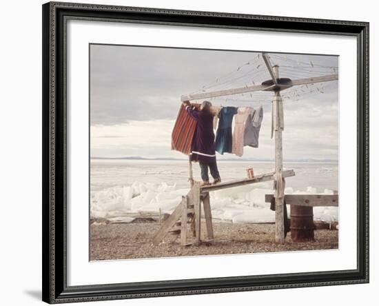 Alaskan Woman Hanging Her Laundry to Dry Along the Edge of an Ice Sheet-Ralph Crane-Framed Photographic Print