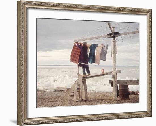 Alaskan Woman Hanging Her Laundry to Dry Along the Edge of an Ice Sheet-Ralph Crane-Framed Photographic Print