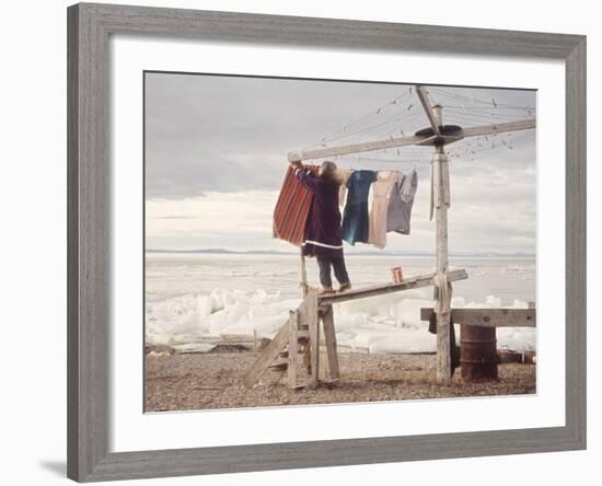 Alaskan Woman Hanging Her Laundry to Dry Along the Edge of an Ice Sheet-Ralph Crane-Framed Photographic Print