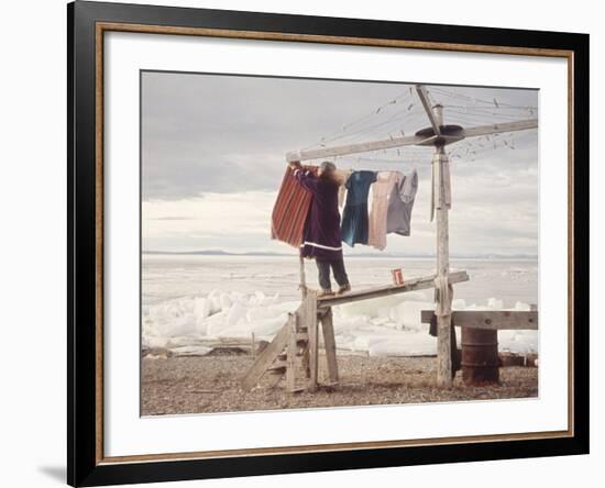 Alaskan Woman Hanging Her Laundry to Dry Along the Edge of an Ice Sheet-Ralph Crane-Framed Photographic Print