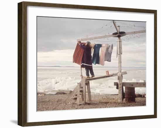 Alaskan Woman Hanging Her Laundry to Dry Along the Edge of an Ice Sheet-Ralph Crane-Framed Photographic Print