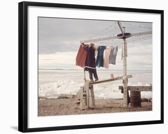 Alaskan Woman Hanging Her Laundry to Dry Along the Edge of an Ice Sheet-Ralph Crane-Framed Photographic Print