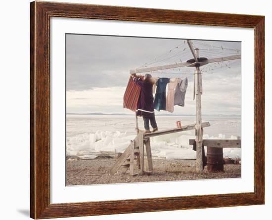 Alaskan Woman Hanging Her Laundry to Dry Along the Edge of an Ice Sheet-Ralph Crane-Framed Photographic Print