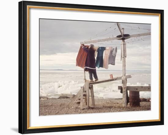 Alaskan Woman Hanging Her Laundry to Dry Along the Edge of an Ice Sheet-Ralph Crane-Framed Photographic Print