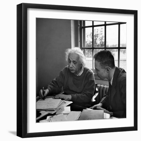 Albert Einstein, in Discussion with Robert Oppenheimer in Office Institute for Advanced Study-Alfred Eisenstaedt-Framed Premium Photographic Print