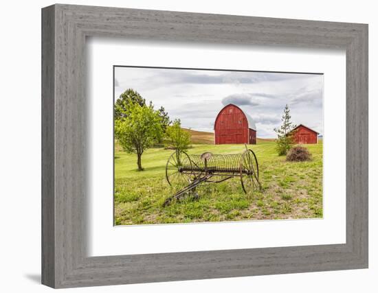 Albion, Washington State, USA. Red barns and antique farm equipment in the Palouse hills.-Emily Wilson-Framed Photographic Print