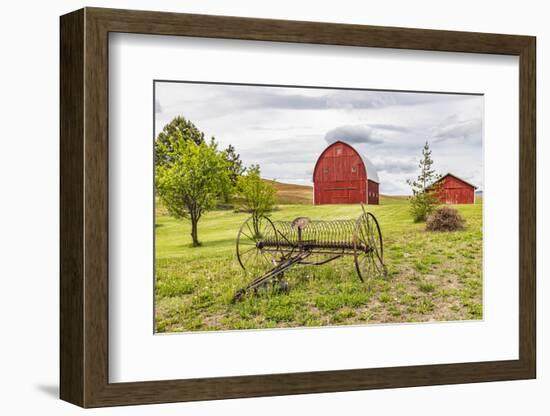 Albion, Washington State, USA. Red barns and antique farm equipment in the Palouse hills.-Emily Wilson-Framed Photographic Print