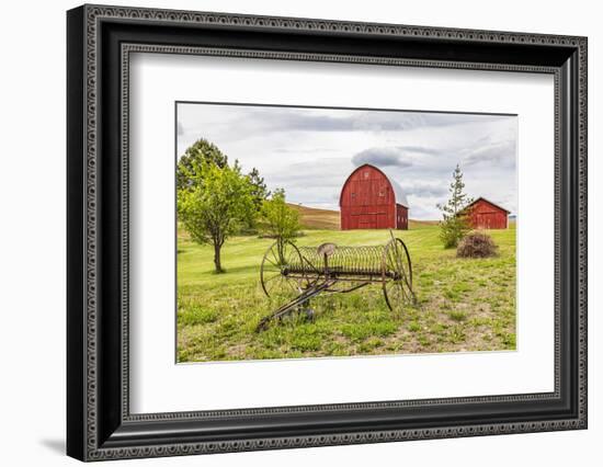 Albion, Washington State, USA. Red barns and antique farm equipment in the Palouse hills.-Emily Wilson-Framed Photographic Print