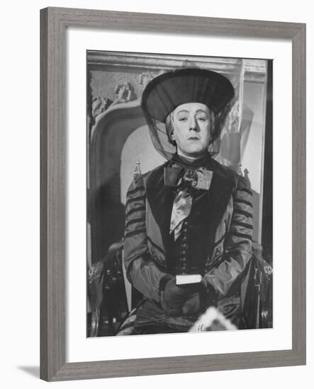 Alec Guinness During a Scene from the Movie "Kind Hearts and Coronets"-null-Framed Premium Photographic Print