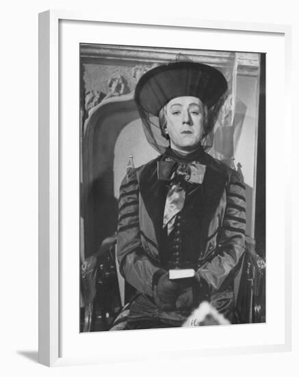 Alec Guinness During a Scene from the Movie "Kind Hearts and Coronets"-null-Framed Premium Photographic Print