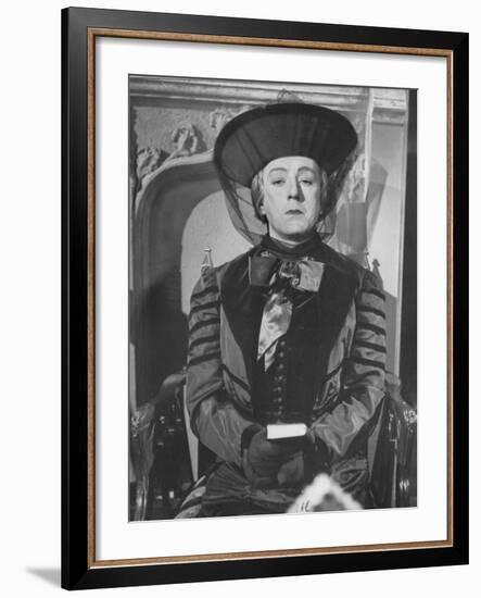 Alec Guinness During a Scene from the Movie "Kind Hearts and Coronets"-null-Framed Premium Photographic Print