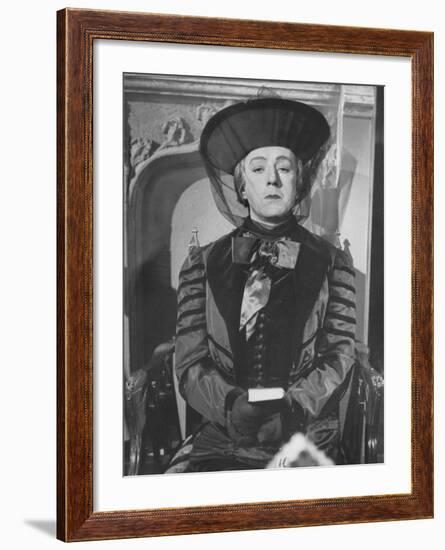 Alec Guinness During a Scene from the Movie "Kind Hearts and Coronets"-null-Framed Premium Photographic Print