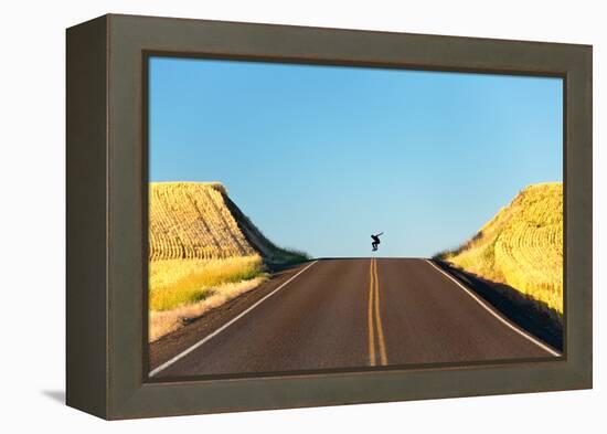 Alek Engerbretson Skateboarding Down A Rural Highway Near Oakesdale, Washington-Ben Herndon-Framed Premier Image Canvas