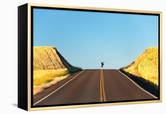 Alek Engerbretson Skateboarding Down A Rural Highway Near Oakesdale, Washington-Ben Herndon-Framed Premier Image Canvas