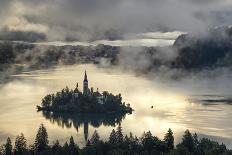 Europe, Slovenia, Bled - A Pletna Boat Arriving At The Island Of Lake Bled During A Foggy Sunrise-Aliaume Chapelle-Photographic Print