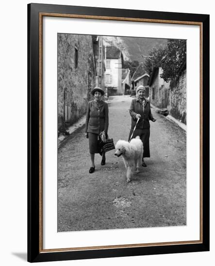 Alice B. Toklas and Author Gertrude Stein, Walking Poodle "Basket" During Liberation from Germans-Carl Mydans-Framed Premium Photographic Print