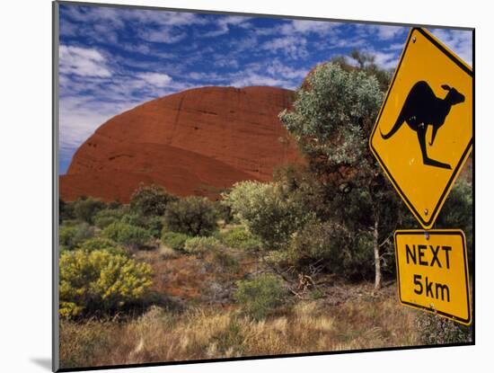 Alice Springs, Traffic Sign Beside Road Through Outback, Red Rocks of Olgas Behind, Australia-Amar Grover-Mounted Photographic Print