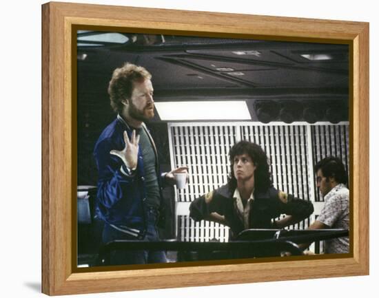 Alien, 1979 directed by Ridley Scott On the set; the director (Ridley Scott) with Sigourney Weaver -null-Framed Stretched Canvas