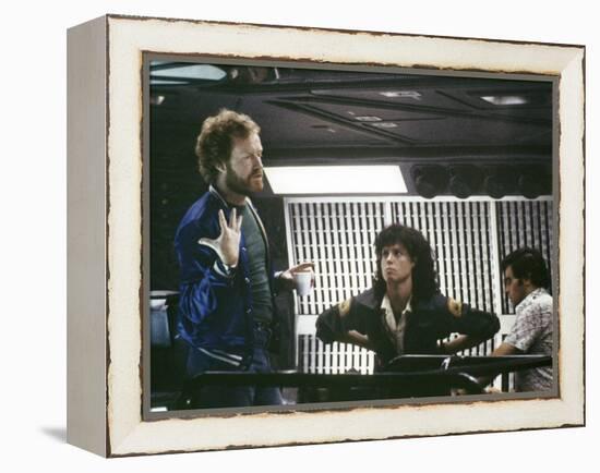 Alien, 1979 directed by Ridley Scott On the set; the director (Ridley Scott) with Sigourney Weaver -null-Framed Stretched Canvas