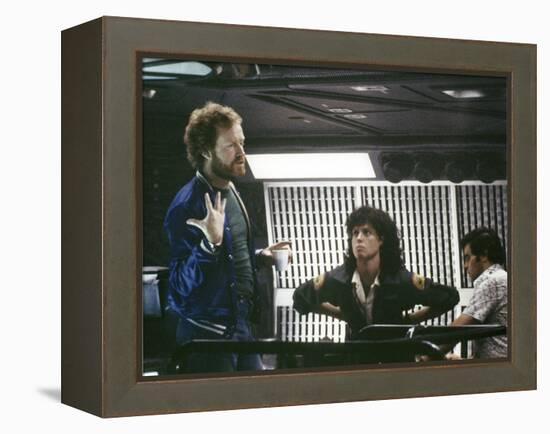 Alien, 1979 directed by Ridley Scott On the set; the director (Ridley Scott) with Sigourney Weaver -null-Framed Stretched Canvas
