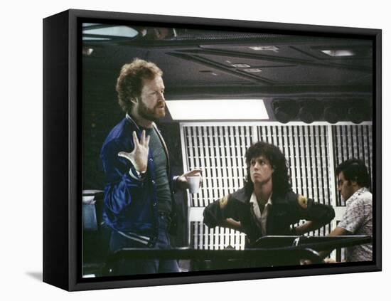 Alien, 1979 directed by Ridley Scott On the set; the director (Ridley Scott) with Sigourney Weaver -null-Framed Stretched Canvas