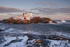 Maine's Nubble (Cape Neddick) Lighthouse Guides Mariners during the Winter Holiday Season.-Allan Wood Photography-Photographic Print