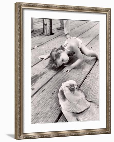 Allen Cook's Daughter Looking at the Open Mouth of a Just Caught, Giant Fish-Alfred Eisenstaedt-Framed Photographic Print