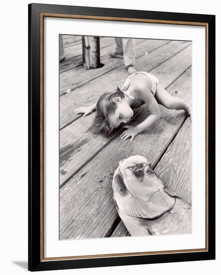 Allen Cook's Daughter Looking at the Open Mouth of a Just Caught, Giant Fish-Alfred Eisenstaedt-Framed Photographic Print