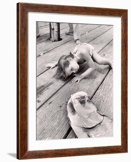 Allen Cook's Daughter Looking at the Open Mouth of a Just Caught, Giant Fish-Alfred Eisenstaedt-Framed Photographic Print