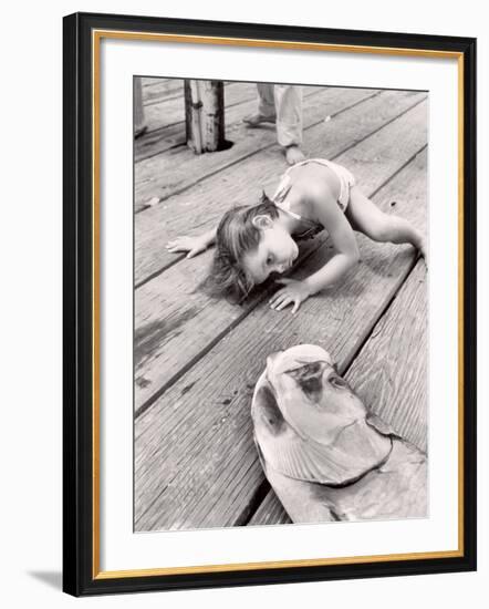 Allen Cook's Daughter Looking at the Open Mouth of a Just Caught, Giant Fish-Alfred Eisenstaedt-Framed Photographic Print