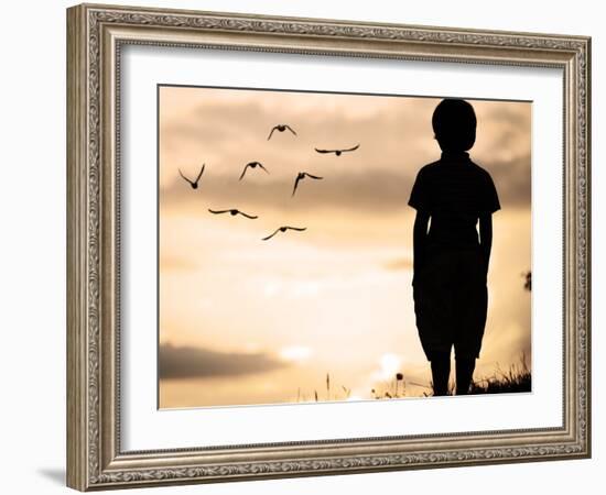 Alone Kid Standing on Field Looking far Away on Birds Flock-zurijeta-Framed Photographic Print
