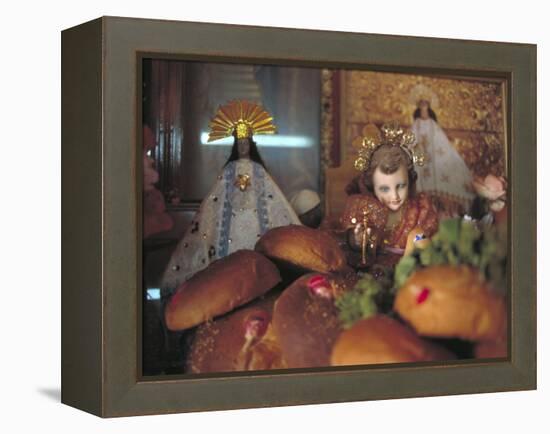 Altar of Food, Candles, Baby Jesus Statues and the Virgins of Soledad and Guadalupe, Oaxaca, Mexico-Judith Haden-Framed Premier Image Canvas