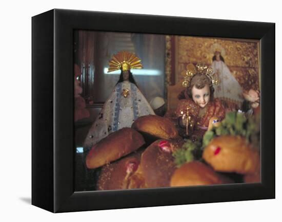 Altar of Food, Candles, Baby Jesus Statues and the Virgins of Soledad and Guadalupe, Oaxaca, Mexico-Judith Haden-Framed Premier Image Canvas