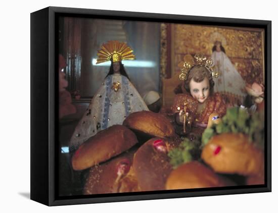 Altar of Food, Candles, Baby Jesus Statues and the Virgins of Soledad and Guadalupe, Oaxaca, Mexico-Judith Haden-Framed Premier Image Canvas
